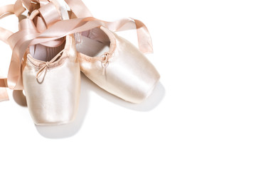Pink ballet shoes isolated