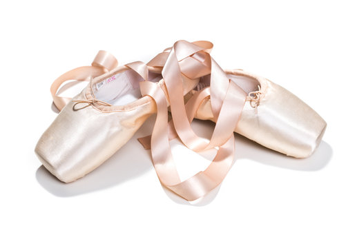 Pink ballet shoes isolated