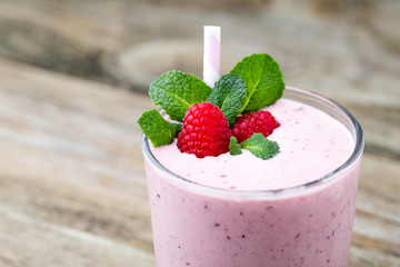 Raspberry milk shake with mint decor.
