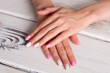 Fototapeta premium Delicate white and pink manicure.