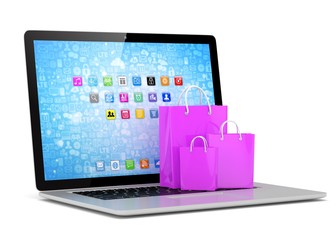 laptop and  shopping pags on white background