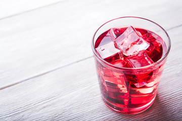 Cold cherry juice with ice cubes