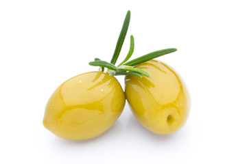 Olives on leaves isolated on white.