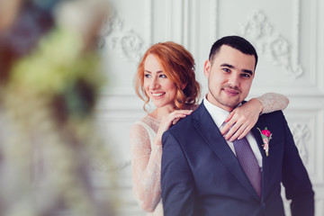 stylish luxury wedding couple hugging