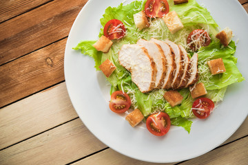 fresh cesar salad in white plate
