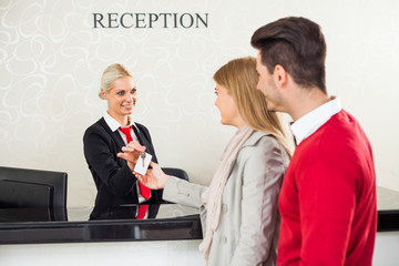 Young couple check in at hotel reception