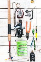 Various fisherman's equipment on wooden background