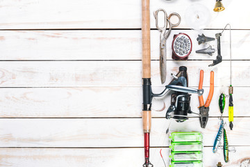 Various fisherman's equipment on wooden background