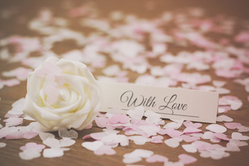 Place tag surrounded by heart shaped confetti