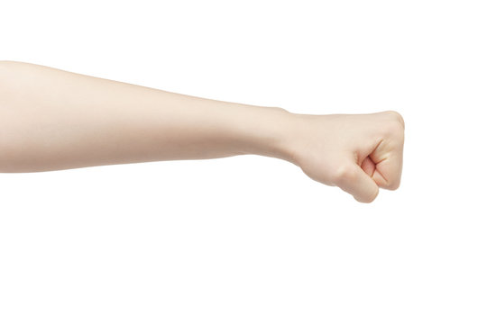 young female left hand shows fist, isolated on white background