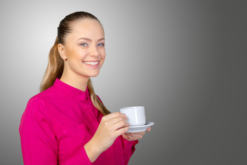 Beautiful and smiling woman with a cup of coffee