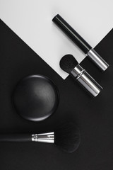 Make up arranged against black white