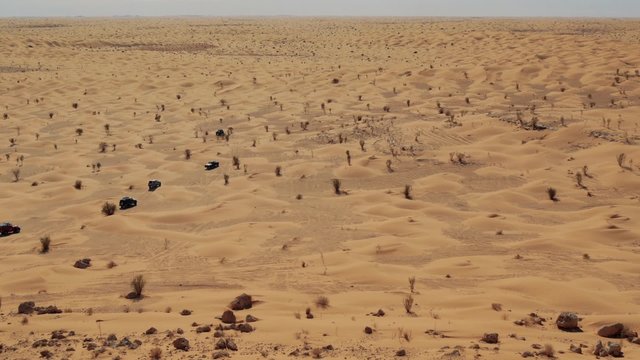 driving off-road car in the sahara desert 