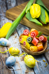 Citrus candy, yellow tulips and Easter eggs