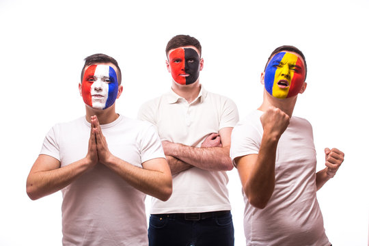 France - pray, Albania - serious, Romania – win. Football fans of national teams with crossed hand look at camera on white background. European 2016 football fans concept.