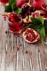 Fresh pomegranates and juice, selective focus