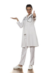 a young woman doctor in uniform holding imaginary object