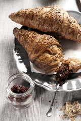 Croissant breakfast with jam