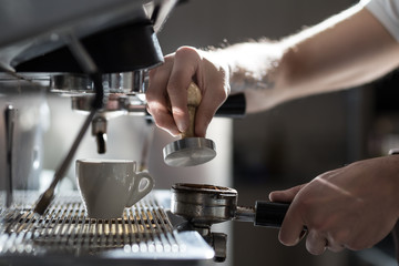 coffee making process; espresso cup and coffee machine;
