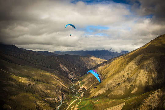Paragliders flying over the Caucasus mountains