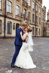 The bride groom gently embraced