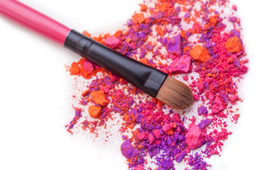 Colorful eye shadow crashed with brush make up accessory