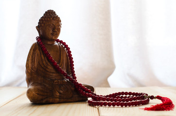 Closeup of  buddha and  mala beads for meditation