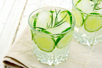 Lemonade with cucumber and rosemary in glassful