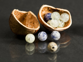 Hazelnut shell with small gemstones