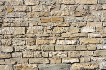 Wall of big rough granite boulders