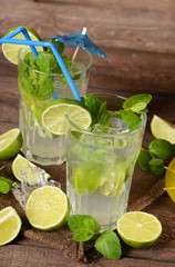 Mojito drink on old wooden background