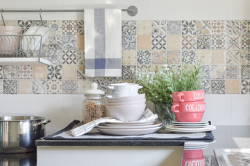 Fototapeta na wymiar modern ceramic kitchenware and utensils on the black granite countertop