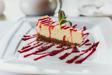 Delicious dessert cheesecake with cherry jam