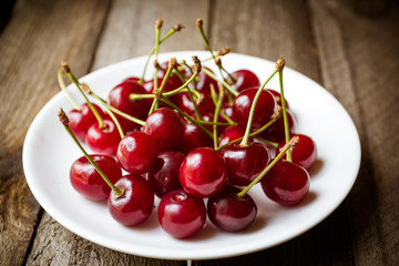 Fruit food concept. Fresh cherries on wood