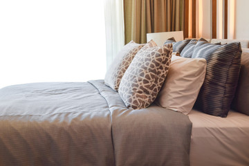 stylish bedroom interior design with brown pillows on bed - white background and clipping path