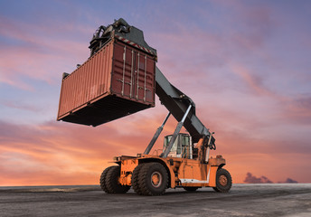 Forklift handling container box loading - Powered by Adobe