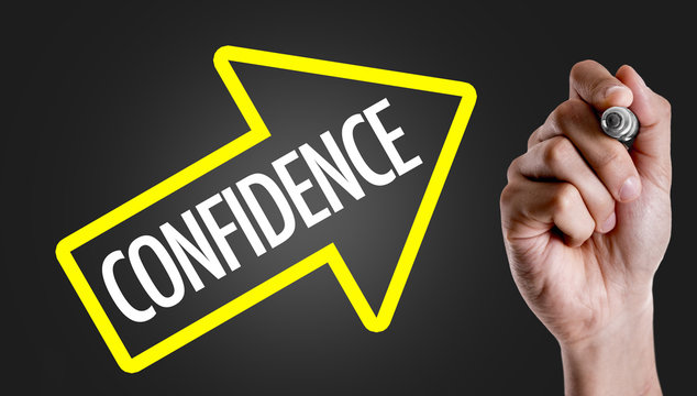 Hand writing the text: Confidence