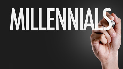 Hand writing the text: Millennials
