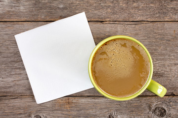 Obraz na płótnie Canvas Cup of coffee and blank napkin
