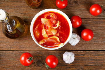Still life with tomatoes and onion sauce