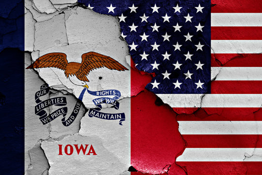 flags of Iowa and USA painted on cracked wall