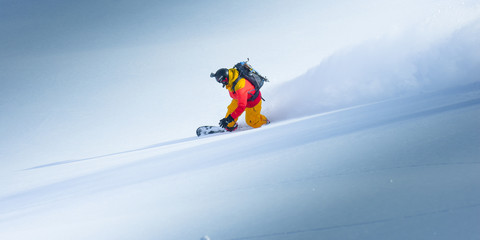 Naklejka na ściany i meble Snowboarding in the winter