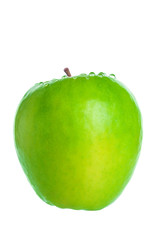 Green apple with water drops closeup