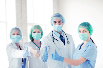 group of doctors in operating room