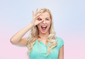 young woman making ok hand gesture