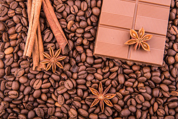 Плитка шоколада, зерна кофе, корица и анис