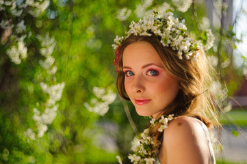 beautiful  woman in a spring garden