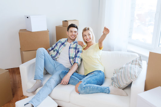 couple with boxes moving to new home and dreaming
