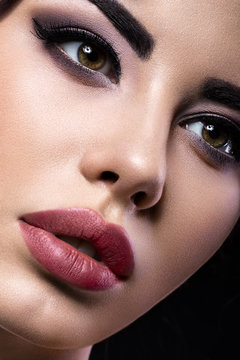 Beautiful brunette girl with arabic evening make-up and perfect skin. Beauty face. Close up