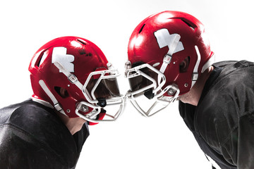 The two american football players fighting on white background